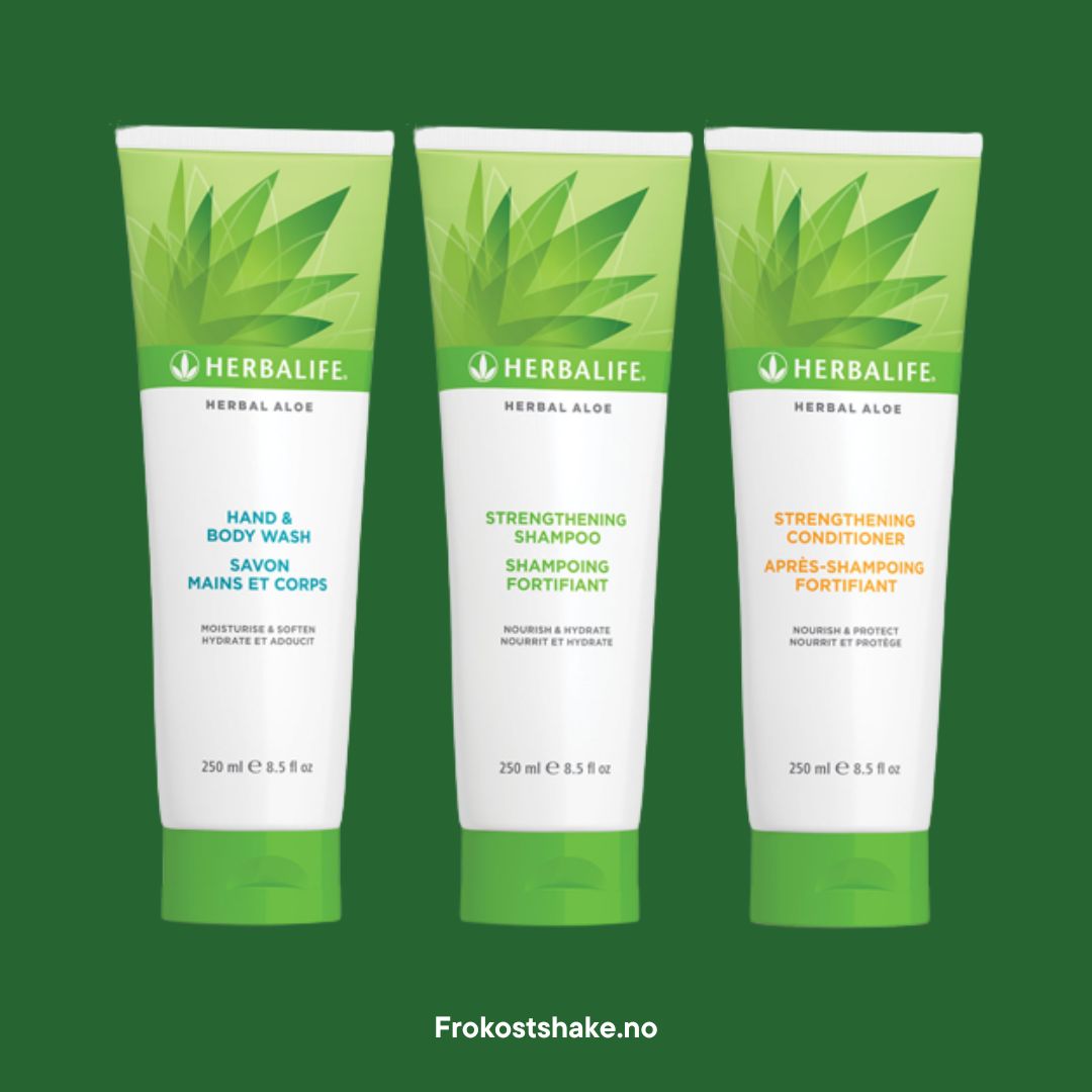 En tube Herbalife Herbal Aloe Strengthening Shampoo, Strengthening Conditioner og Hand & Body Wash på grønn bakgrunn.