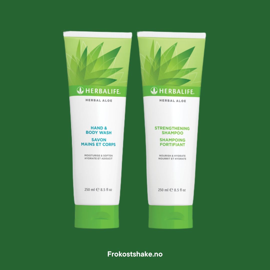 En tube Herbalife Herbal Aloe Strengthening Shampoo og Hand & Body Wash på grønn bakgrunn.