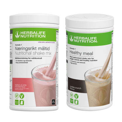 En boks Herbalife Formula 1 shakemix med bringebær og hvit sjokoladesmak og en med cookie crunch-smak.