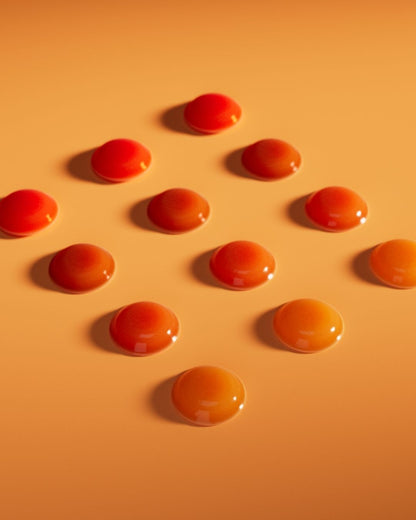 12 stykk Herbalife Gels CoQ10Vita gele-tyggetabletter ligger på en flate. 