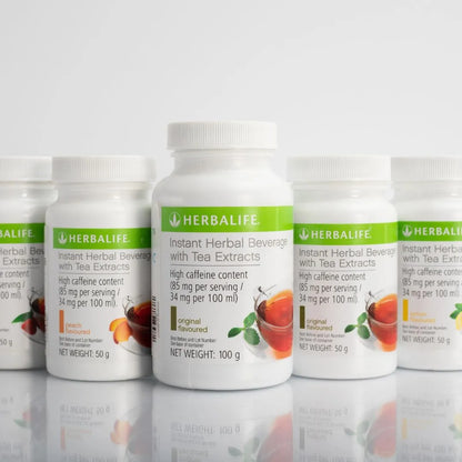 Fem bokser Herbalife Instant urtekonsentrat te med de ulike smakene sitron, fersken, original og bringebær.