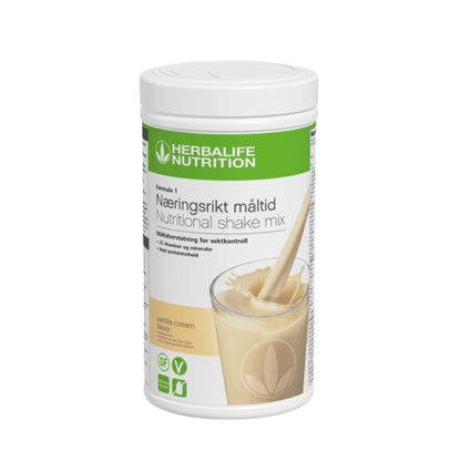 Boks Herbalife Formula 1 shakemix med vanilla cream-smak. Shakeboksen har bilde av en vaniljeshake som helles i et glass og er merket glutenfri og vegansk.