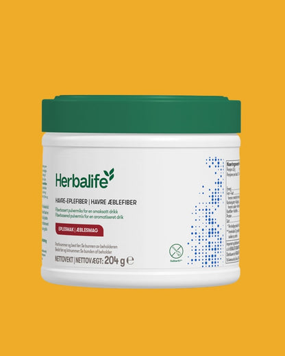 En boks Herbalife Havre-eplefiberdrikk kosttilskudd med fiber og eplesmak på gul bakgrunn.