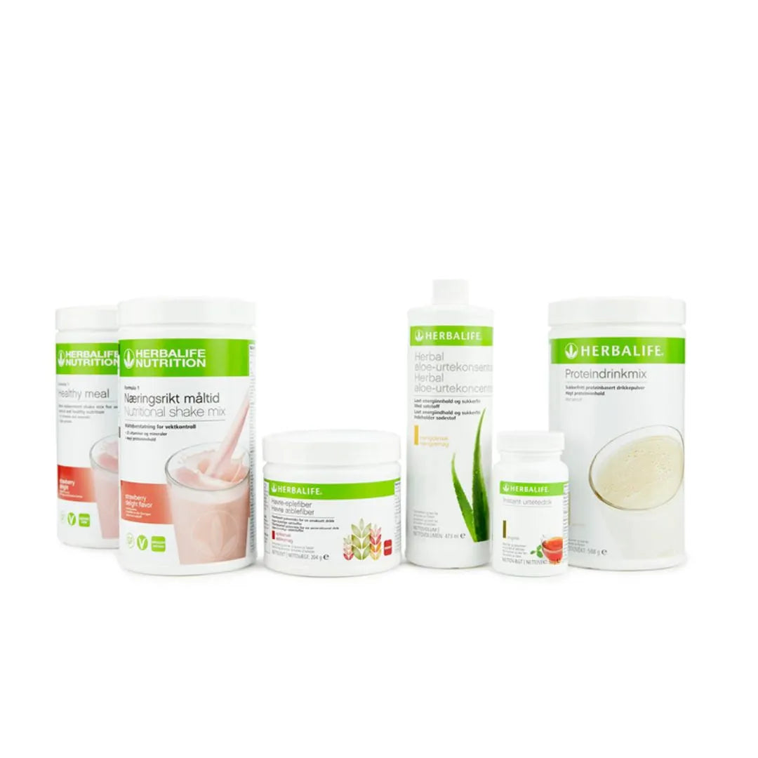 Bildet viser Herbalife-produktene som Frokostpakke vektkontroll-pakke strawberry delight består av: To bokser Herbalife-shake med jordbær-smak, Herbal Aloe aloevera-juice med mangosmak, Instant urtete med original-smak, havre-eplefiberdrikk og Proteindrinkmiks.   