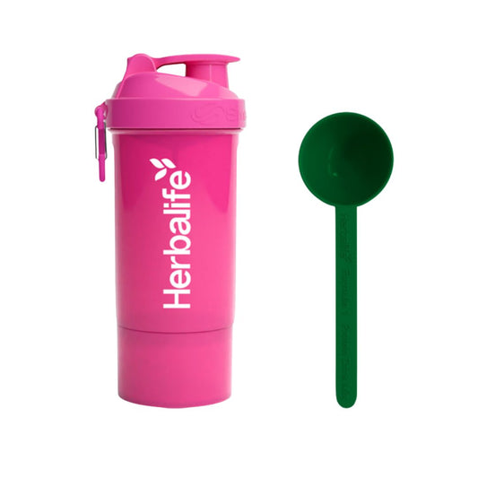 Rosa Herbalife SmartShake 600 ml med hvit logo og karabinkrok, plassert ved siden av en grønn Herbalife-måleskje. Produktfoto på hvit bakgrunn.