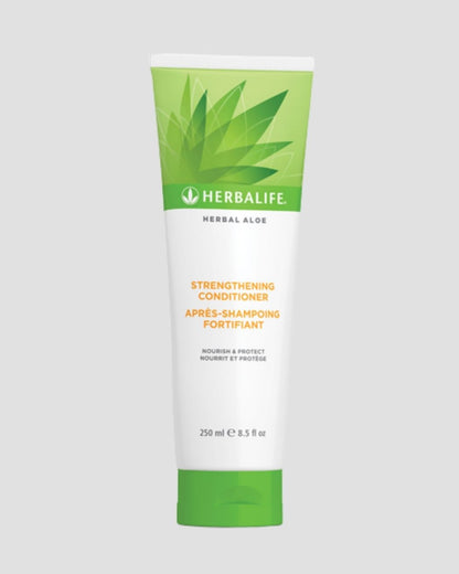 Herbalife Herbal Aloe Strengthening Conditioner balsam på grå bakgrunn