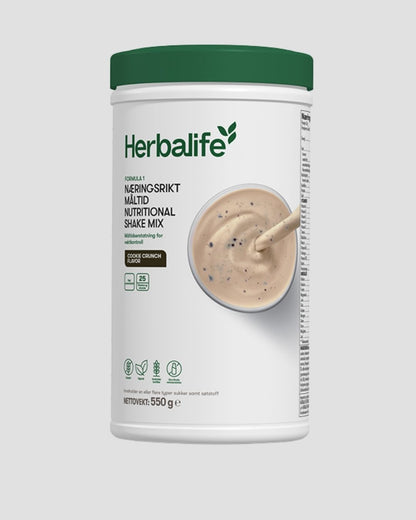 Herbalife F1 shake med Cookie Crunch smak på grå bakgrunn.  Næringsriktig måltid og måltidserstatter.