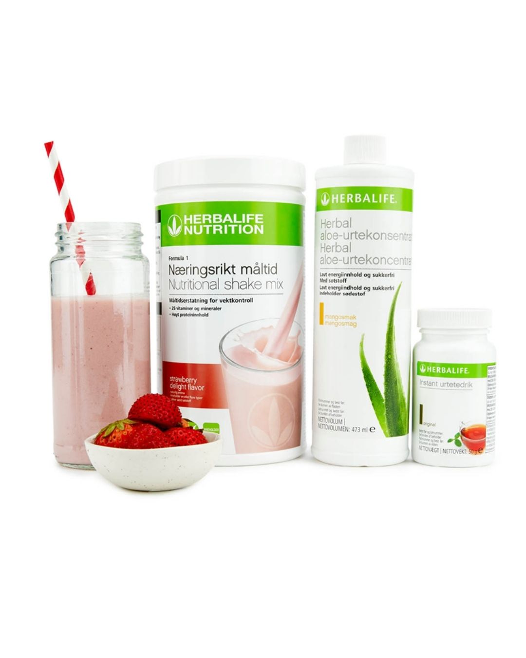Bildet viser Herbalife-produktene som Frokostpakke basic jordbær består av; Herbalife-shake med jordbærsmak, Herbal Aloe aloevera-juice med mangosmak og Instant urtete med original-smak samt en jordbærshake i et glass med sugerør og noen jordbær i en skål. 