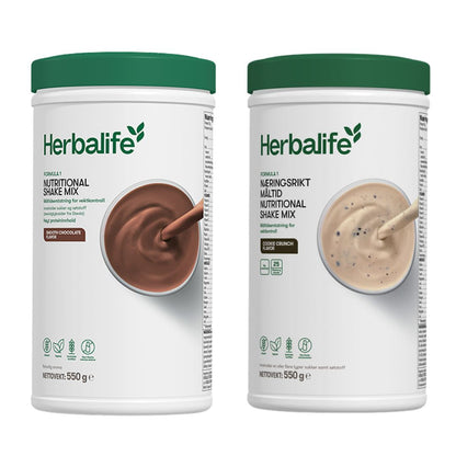 En boks Herbalife Formula 1 shakemix med sjokoladesmak og en med cookie crunch-smak.