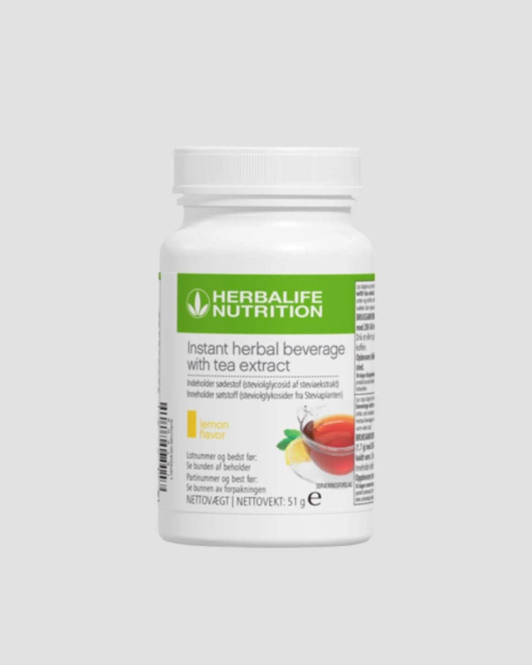 En boks Herbalife Instant Lemon urtekonsentrat te med sitronsmak, 51 gram på grå bakgrunn.